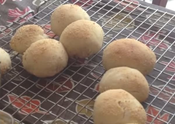 cooling pandesal in a wire cookie rack