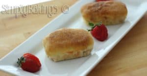 French Breakfast bread on a white place garnished with strawberries