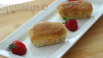 French Breakfast bread on a white place garnished with strawberries