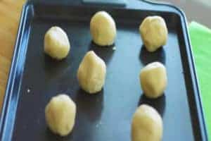 easy sugar cookie dough balls on a cookie sheet