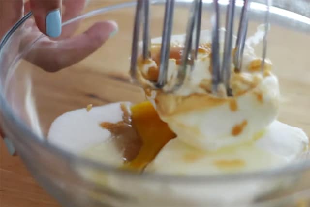 mixing butter, sugar, and vanilla in a glass bowl