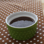 chocolate ganache in a small green bowl