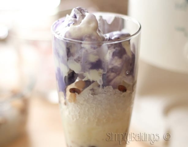 halo halo topped with ube ice cream in a tall glass