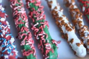 chocolate pretzel rods decorated with sprinkles