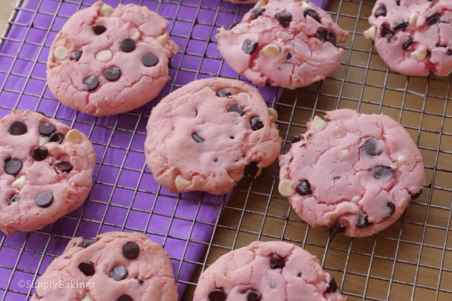 freshly baked strawberry cookies on a cooling rack