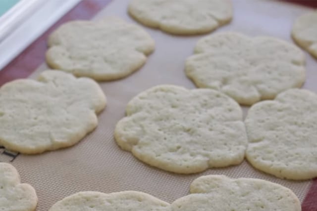freshly baked shamrock cookies on a baking sheet