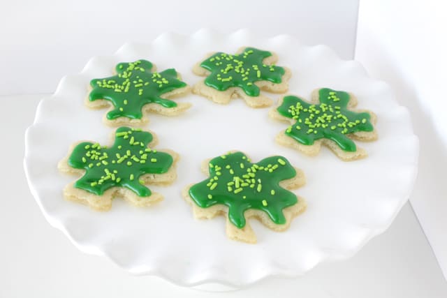 shamrock cookies on a white plate