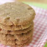 Piled cookie butter cookies on a plaid plate