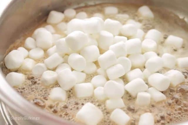 melting the mini marshmallows with the butter for the rice krispie eggs recipe