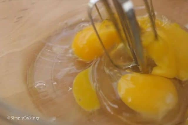 beating eggs with a handheld mixer for the waffle cone recipe 