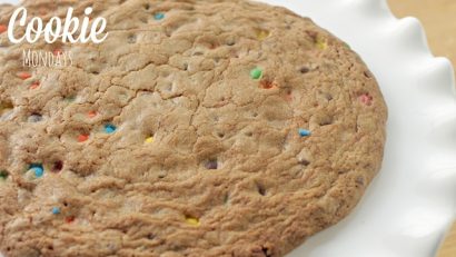 Freshly baked M&M Cookie Pizza on a plate