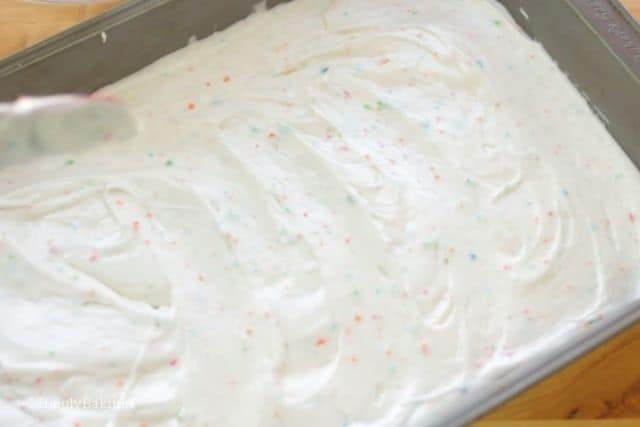 pouring the cake pop batter into a baking pan