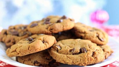 chewy and gooey gingerbread chocolate chip cookies on a white plate