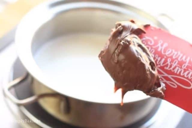 adding in Nutella to the hot milk