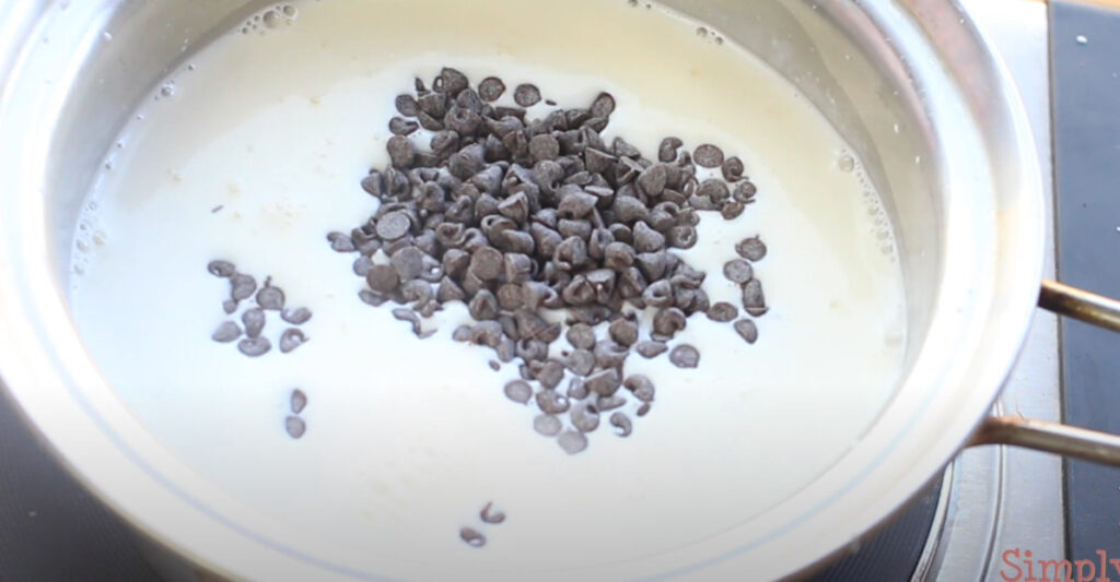 putting chocolate chips in milk mixture