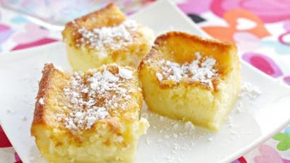 Filipino Custard Cake drizzled with powdered sugar