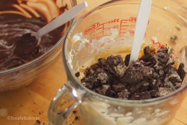 mixing the crushed oreos into the peanut butter mixture