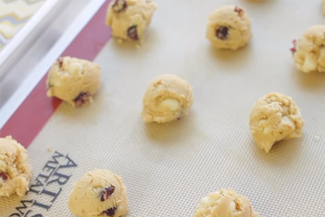 ready to bake white chocolate cranberry cookies on a baking mat