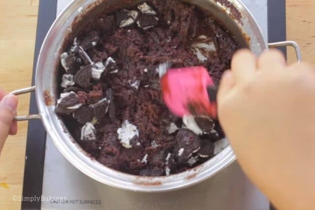 adding in oreo chunks to the brownie batter