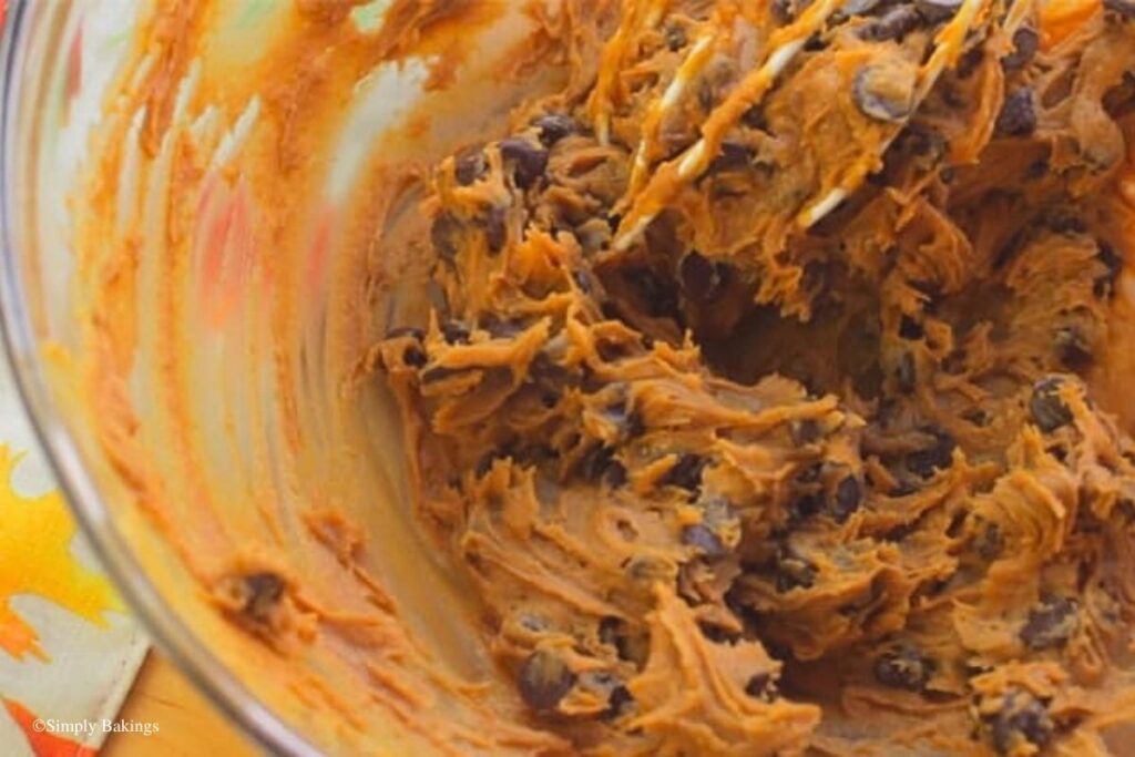 Mixing bowl filled with dough and chips