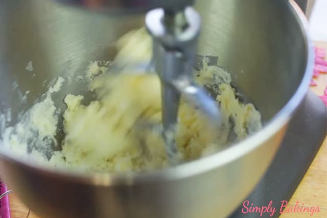 mixing butter and sugar using a stand mixer for easy Boston cream cupcakes recipe