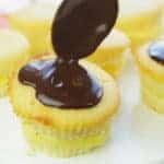 drizzling ganache on top of cupcake