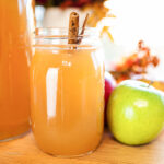 apple cedar punch on table with apples