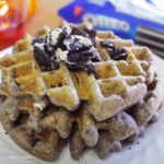 Pieces of Oreo sprinkled on waffles