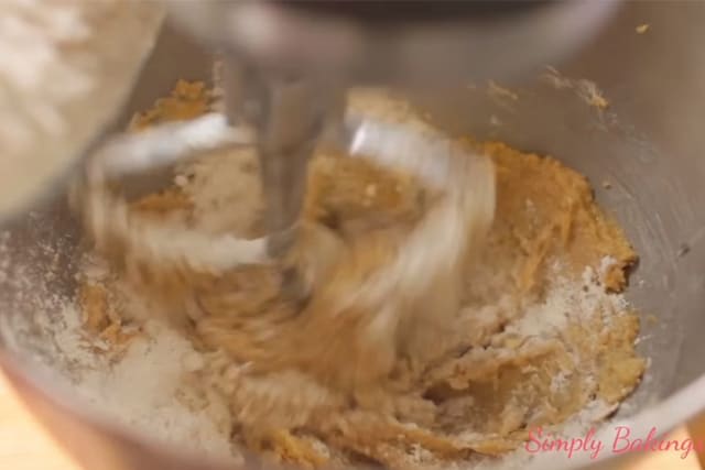 mixing the wet ingredients and the dry ingredients of the Peanut Butter Sprinkle cookies
