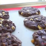 delicious and fudgy double chocolate chip cake mix cookies on a cookie sheet
