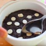 taking a portion of the no bake chocolate brownie cookie with a spoon