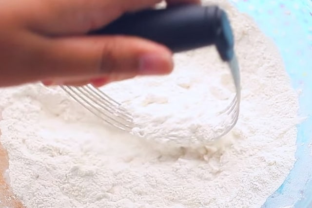 mixing ingredients using a pastry mixer