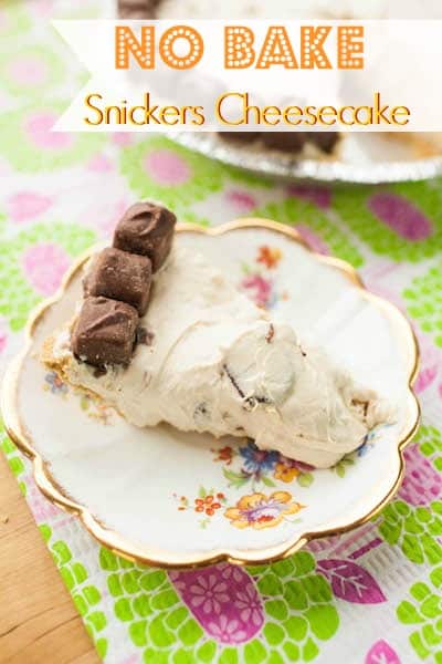 no bake snickers cheesecake slice on a pretty plate