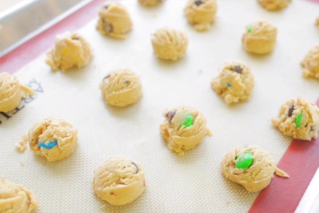 ready to bake assorted candy mix cookies on a cookie sheet