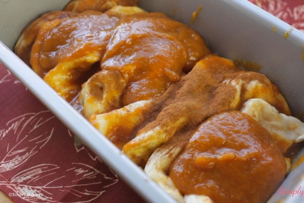 Soft layers of Pumpkin Cinnamon Pull-Apart Bread in a pan