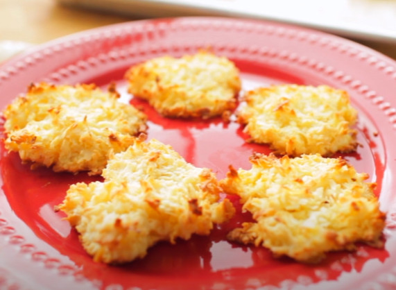 five coconut macaroon cookies on red plate