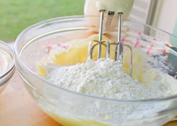 wet ingredients mixed with flour in a mixing bowl for strawberry shortcake cookie recipe