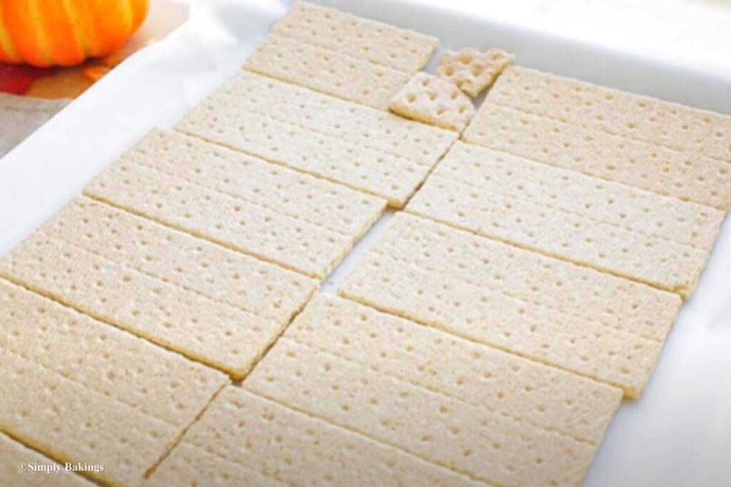 Graham crackers spread on a baking pan