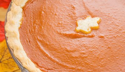 Vegan pumpkin pie on a brown table