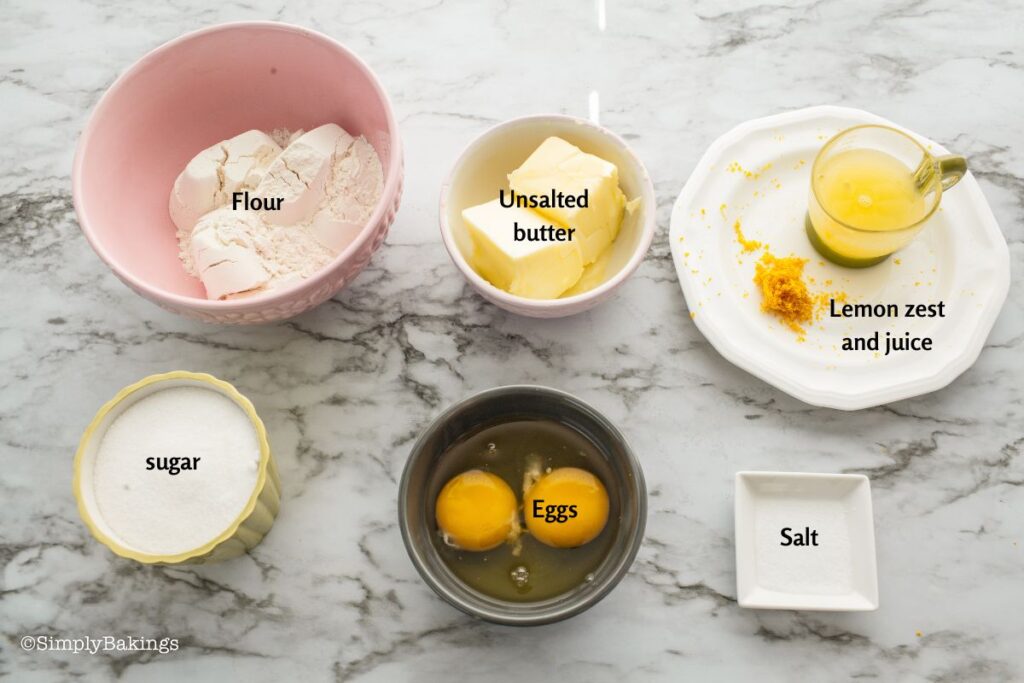 All ingredients of Lemon Brownies with Lemon Glaze in separate white bowls