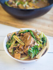 vegan kare kare in a white bowl