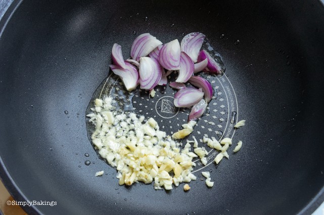 sauteeing onion and garlic in a pan for Pinakbet recipe