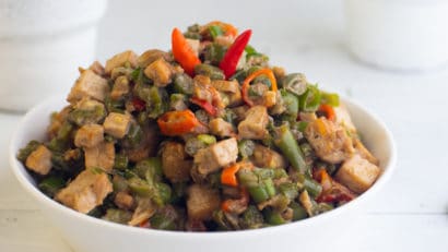 bicol express in a white bowl on a table