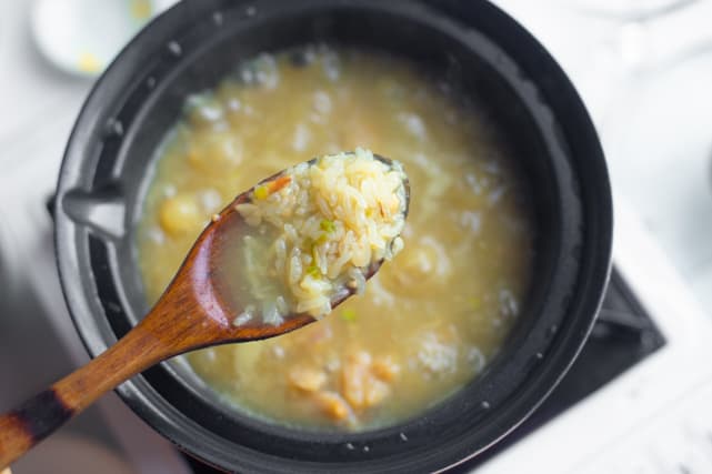cooked sticky rice in a ladle 