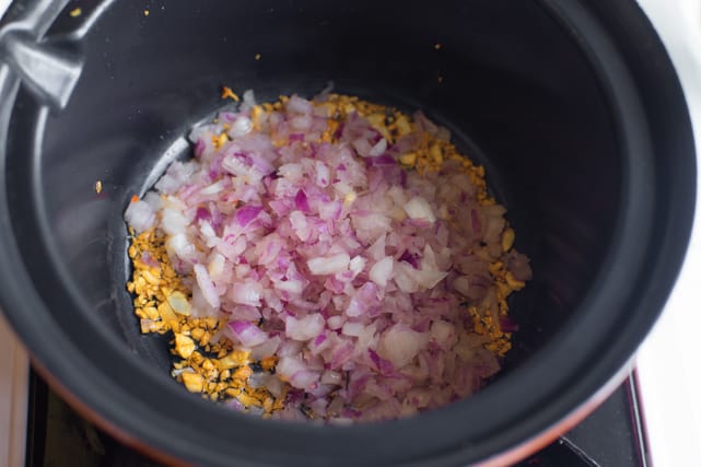 sauteing onion with the garlic for vegetarian congee recipe