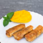 freshly cooked vegetarian lumpiang shanghai on a white plate