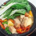 vegan pochero in a black bowl