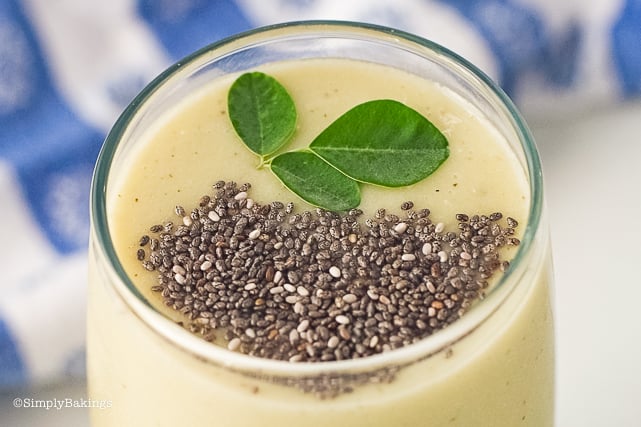 close up photo of moringa pineapple smoothie in a glass