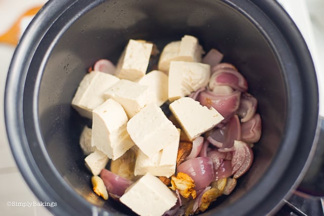 sauteing tofu along with garlic and onions for Binakol recipe