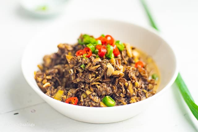 vegan ginataang puso ng saging with chili on a white bowl